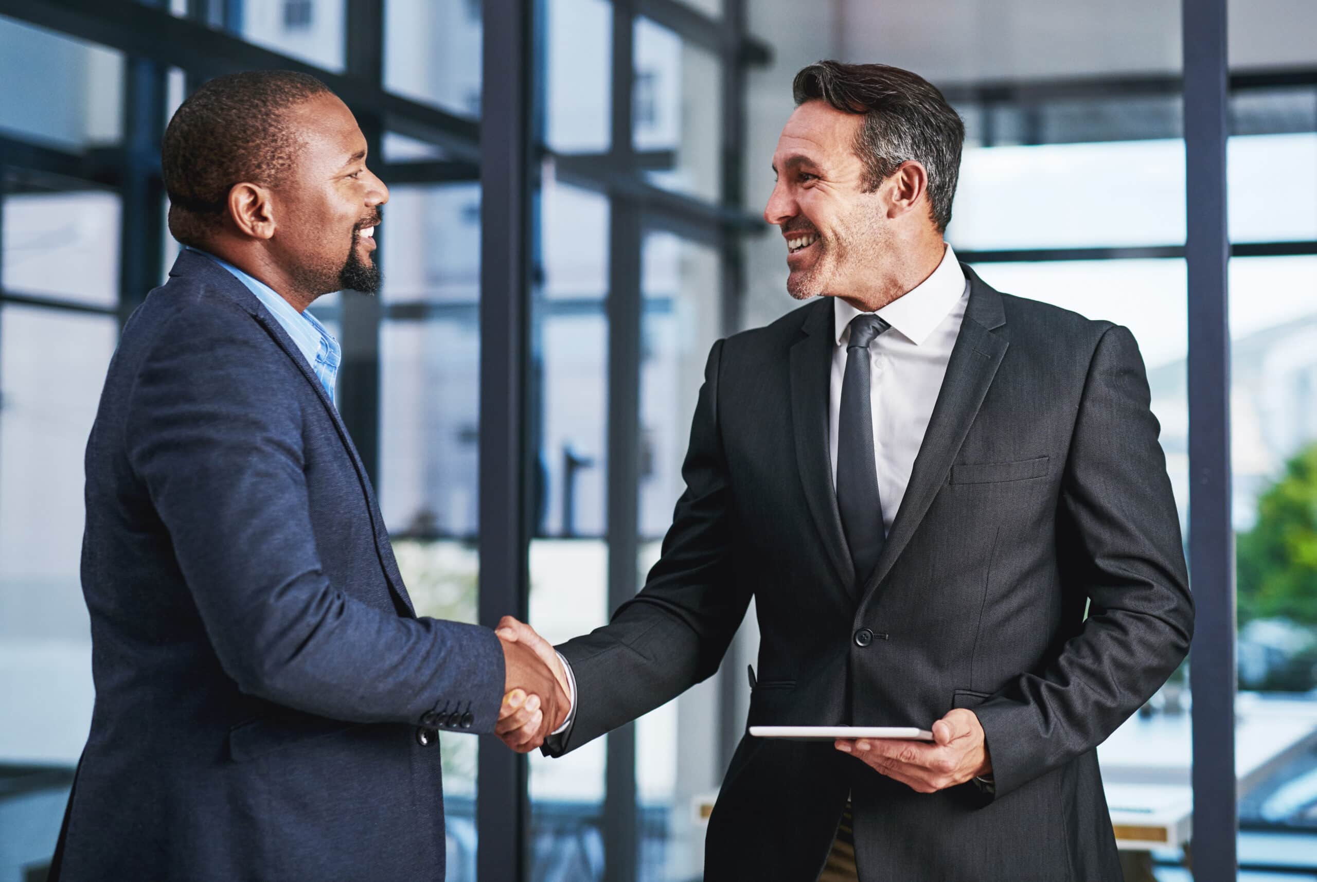 Someone shaking hands in an interview for a government contract