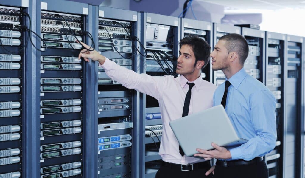 a few men in a server room