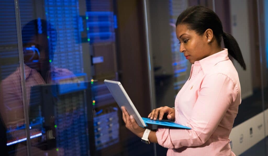 a woman holding a laptop